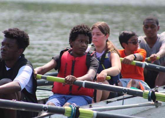Group of middle school students rowing